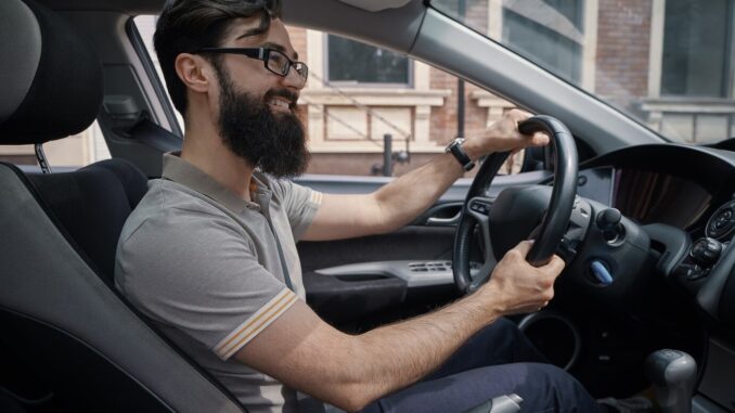 handsome-happy-man-driving-car_1