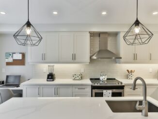 white wooden kitchen cabinet with black pendant lamp