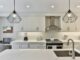 white wooden kitchen cabinet with black pendant lamp