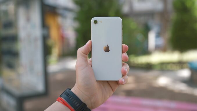 Photo by Onur Binay a person holding a phone
