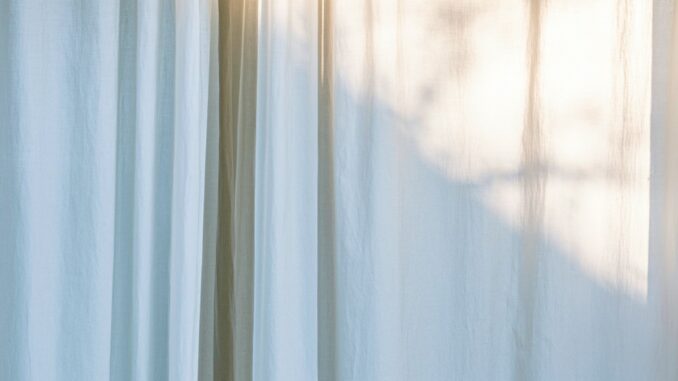 Photo by Mila Albrecht white window curtains